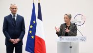 France's Prime Minister Elisabeth Borne (right) and France's Minister for the Economy and Finances Bruno Le Maire at a press conference to present the government's plan for a pension reform in Paris, France, January 10, 2023. (Bertrand Guay/Pool via REUTERS)