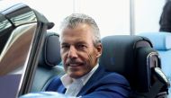 Torsten Muller-Otvos, CEO of Rolls-Royce, poses at a hand made car described as 'the most refined picnic facility on earth', at the company's factory in Goodwood, Britain May 27, 2021. (REUTERS/Stuart McDill)