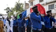 Pallbearers carry the coffin of Solo Sandeng during his funeral in Banjul on January 10, 2023. (Photo by Muhamadou BITTAYE / AFP)
