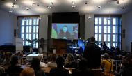 Ukrainian President Volodymyr Zelensky is displayed on a screen as he addresses students per video link at the Humboldt university in Berlin on January 17, 2023. (Photo by Tobias Schwarz / AFP)

