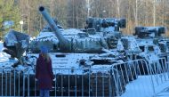A woman looks at a tank of Ukrainian Armed Forces destroyed during Russia-Ukraine conflict, at an exhibition in the museum 