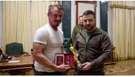 Sean Penn, left, with Ukraine's President Volodymyr Zelensky. The actor was in Kiev when Russia invaded Ukraine. STR / UKRAINIAN PRESIDENTIAL PRESS SERVICE/AFP
