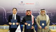 Officials of UDEI, Ajlan & Bros Holding at the signing ceremony.