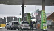 A driver refuels a car at a gas station of Hungarian oil company MOL Group in Esztergom, hungary, January 21, 2023. Reuters/Marton Monus