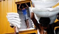 
Laborers carry sacks of flour in the main market as Sri Lankan President Ranil Wickremesinghe announced 2023 budget amid the country's economic crisis, in Colombo, Sri Lanka, November 14, 2022. (REUTERS/ Dinuka Liyanawatte)