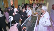 WCM-Q faculty offering a demonstration to high school students during WCM-Q’s Medicine Unlimited fair.
