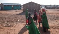 Children walk at a school in the camp for internally displaced people of Farburo in the village of Adlale, near the city of Gode, Ethiopia, on January 11, 2023. - The last five rainy seasons since the end of 2020 have failed, triggering the worst drought in four decades in Ethiopia, Somalia and Kenya. And the next rainy season, from March to May, is also expected to be below average. According to the UN, drought has plunged 12 million people into 
