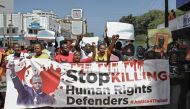 Members of various Human Rights Defender (HRD) groups hold a protest against the brutal killing of renowned human rights lawyer, Thulani Maseko at his home in the kingdom of eSwatini (formerly known as Swaziland) in the Kenyan capital, Nairobi on January 30, 2023. (Photo by Tony KARUMBA / AFP)
