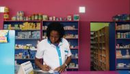 A vendor writes as she stands in a legal pharmacy in Abidjan, Ivory Coast on October 16, 2018. File Photo / Reuters