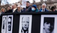 John Finucane, Sinn Fein MP for Belfast North, is seen during a minute's silence outside the Houses of Parliament ahead of the 50th anniversary of 