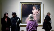 Visitors look at the painting 'Sonja Knips' (1897/1898) by Austrian painter Gustav Klimt (1862-1918), during a preview of the exhibition 'Klimt inspired by Van Gogh, Rodin, Matisse' at The Belvedere Museum in Vienna, Austria on February 2, 2023. (Photo by JOE KLAMAR / AFP)