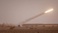 In this file photo taken on June 21, 2022, a US M142 High Mobility Artillery rocket System (HIMARS) fires salvoes during the 'African Lion' military exercise in the Grier Labouihi region of southeastern Morocco. (Photo by FADEL SENNA / AFP)