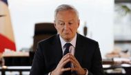 French Economy Minister Bruno Le Maire gestures as he speaks to the press in the minister's office, in Paris, on February 3, 2023. (Photo by Ludovic Marin / AFP)