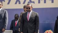 In this file photo taken on June 05, 2022 Abiy Ahmed, Prime Minister of Ethiopia, stands for a moment of silence during a ceremony of honoring members of the Federal Police Force in Addis Ababa, Ethiopia.  (Photo by Amanuel Sileshi / AFP)
 