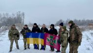 Ukrainian prisoners of war (POWs) pose for a picture after a swap, amid Russia's attack on Ukraine, in an unknown location, Ukraine, in this handout picture released on February 4, 2023. Press Service of the General Staff of the Ukrainian Armed Forces/Handout via REUTERS