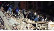 In this video grab from AFP TV taken on February 6, 2023, rescuers search for victims of a 7.8-magnitude earthquake that hit Diyarbakir, in southeastern Turkey, levelling buildings across several cities and causing damages in neighbouring Syria. (Photo by Mahmut BOZARSLAN / AFPTV / AFP)