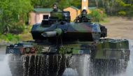 This file photo taken on May 20, 2019 shows soldiers on a Leopard 2 A7 main battle tank of the German armed forces Bundeswehr driving during an educational practice of the 