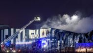 Firefighters extinguish a fire at a drone factory run by US firm Edge Autonomy in Marupe on the outskirts of Latvia's capital Riga on February 7, 2023. (Photo by Gints Ivuskans / AFP)