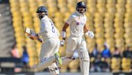 India's Ravindra Jadeja (L) with teammate Axar Patel run between the wickets during the third day of the first Test cricket match between India and Australia on February 11, 2023. (Photo by Indranil Mukherjee / AFP) 