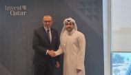 Charge d’affaires a.i. of the Embassy of the Republic of Serbia in the State of Qatar Slobodan Radeka shake hands with Mohammed Ibrahim Al Mulla, investment relations specialist at the Qatar Investment Promotion Agency.