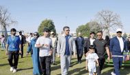 Minister of Labour H E Dr. Ali bin Smaikh Al Marri (centre) participating in an activity organised by the Ministry at Aspire Zone, yesterday.