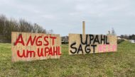Placards reading 'Afraid for Upahl' (L) and 'Upahl says no' are displayed along the main road passing through Upahl, northern Germany on February 13, 2023.