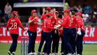 England players celebrate the dismissal of India's Harmanpreet Kaur (not seen) during the Group B T20 women's World Cup cricket match between England and India at St George's Park in Gqeberha on February 18, 2023. (Photo by Marco Longari / AFP)