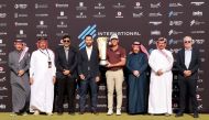International Series Qatar winner Andrew Ogletree poses with the trophy along with Qatar Golf Association (QGA) President Hassan Nasser Al Naimi, Asian Tour CEO Cho Minn Thant, QGA General Secretary Fahad Al Naimi and other officials during the presentation ceremony at the Doha Golf Club, yesterday.
