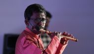 Flutist Saji Manjamala performing at the cultural event 