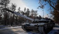 Members of a Ukrainian tank crew prepare their tank for operation in Donetsk region, on February 22, 2023, amid Russia's military invasion on Ukraine. (Photo by ANATOLII STEPANOV / AFP)