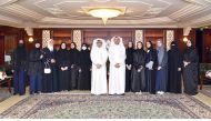 Students from Arwa Bint Abdul Muttalib Independent Secondary School for Girls with QIIB officials during the event held recently.