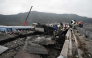 Crushed wagons are seen by the tracks after a train accident in the Valley of Tempi near Larisa, Greece on March 1, 2023. Photo by Sakis MITROLIDIS / AFP. File photo.