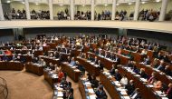 Finnish MPs attend a plenary session of the Finnish parliament on a vote on the country's entry to NATO in Helsinki, Finland on March 1, 2023. - (Photo by Heikki Saukkomaa / Lehtikuva / AFP) 