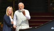 India's Prime Minister Narendra Modi greets his Italian counterpart Giorgia Meloni upon her arrival for a meeting at the Hyderabad House in New Delhi on March 2, 2023. (AFP)