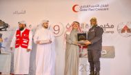 QRCS Secretary-General Ali bin Hassan Al Hammadi (second right) honouring an official at the closing ceremony of 9th Disaster Management Camp. 