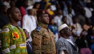 Burkina Faso military leader Captain Ibrahim Traore (C) attends the closing ceremony of the 28th Pan-African Film and television Festival (FESPACO), in Ouagadougou, on March 4, 2023. (Photo by OLYMPIA DE MAISMONT / AFP)