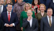 German Chancellor Olaf Scholz (first row, center) and members of his cabinet pose on the stairs of Schloss Meseberg palace in Meseberg near Gransee, northeastern Germany, at the end of the federal cabinet retreat on March 6, 2023. (Photo by Odd ANDERSEN / AFP)