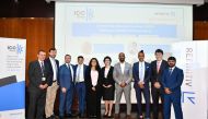 ICC Qatar and Refinitiv officials pose for a photograph after the event.
