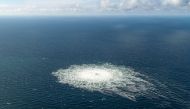 In this file photo taken on September 27, 2022 this handout picture released by the Danish Defence Command shows the gas leak at the Nord Stream 2 gas pipeline as it is seen from the Danish Defence's F-16 rejection response off the Danish Baltic island of Bornholm, south of Dueodde. (Photo by Handout / DANISH DEFENCE / AFP)