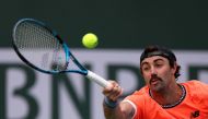 Jordan Thompson of Australia stretches for a forehand in his victory over Stefanos Tsitsipas of Greece during the BNP Parisbas at the Indian Wells Tennis Garden on March 10, 2023 in Indian Wells, California. Harry How/Getty Images/AFP