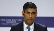 British Prime Minister Rishi Sunak listens during a joint press conference with French President as part of the Franco-British Summit held at the Elysee Palace in Paris, on March 10, 2023. (Photo by GONZALO FUENTES / POOL / AFP)