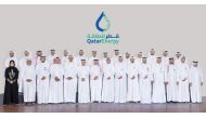 Participants in the third National Defense Course pose for a photograph at the headquarters of QatarEnergy.