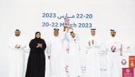 Minister of Sports and Youth H E Salah bin Ghanim Al Ali (2nd right) awarding the winners of the 15th Robotics Schools Championship yesterday as Undersecretary for Educational Affairs at the Ministry of Education and Higher Education Maha Zayed Al Ruwaili (2nd left) and other officials look on.