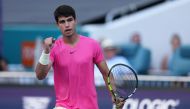 MARCH 26: Carlos Alcaraz of Spain celebrates a point against Dusan Lajovic of Serbia in their third round match at Hard Rock Stadium on March 26, 2023 in Miami Gardens, Florida. Clive Brunskill/Getty Images/AFP 