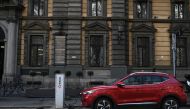 In this file photo taken on March 23, 2023, an MG electric SUV charges at a hub in downtown Milan. Photo by GABRIEL BOUYS / AFP