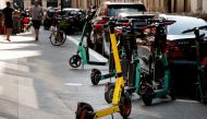In this file photo taken on September, 2021, free floating rental electric scooters are seen on a sidewalk in Paris. Photo by AFP