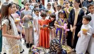 Children collecting Garangao giveaways.