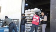 QRCS officials distribute food in Syria.