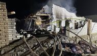 This handout picture taken and released by Ukrainian Presidential Chief of Staff, Andriy Yermak on April 9, 2023, shows a destroyed house after a strike in the city of Zaporizhzhia, amid the Russian invasion of Ukraine. (Photo by Ukrainian Presidential Chief of Staff Andriy Yermak / AFP) 