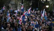 Georgian opposition supporters rally in the center of Tbilisi on April 9, 2023. (Photo by Vano Shlamov / AFP)